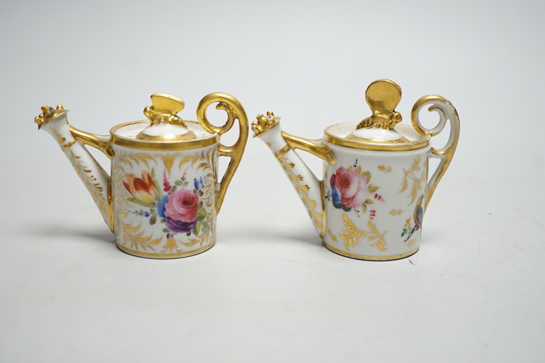 Toy porcelain: Two English porcelain rosewater sprinklers, c.1810, possibly Coalport, each modelled in the form of a watering can